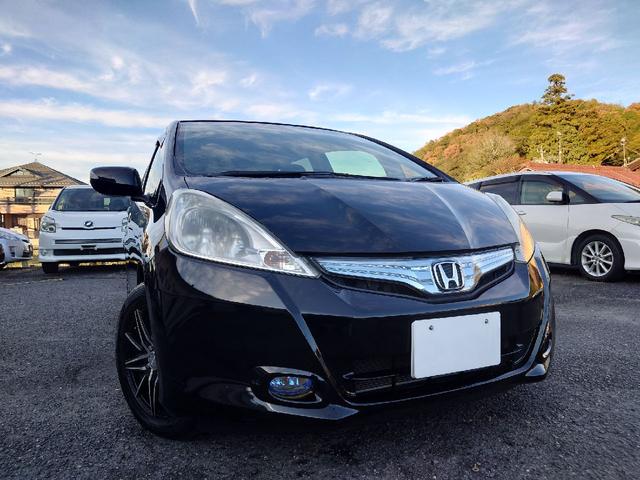 フィットハイブリッド ハイブリッド・10thアニバーサリー 1.3 10thアニバーサリー 下取り車 ナビ Bカメラ ETC ドラレコ TV オートクルーズコントロール スマートキー 盗難防止システム 衝突安全ボディ アルミホイール CD DVD USB(53枚目)