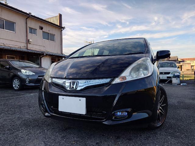 フィットハイブリッド ハイブリッド・10thアニバーサリー 1.3 10thアニバーサリー 下取り車 ナビ Bカメラ ETC ドラレコ TV オートクルーズコントロール スマートキー 盗難防止システム 衝突安全ボディ アルミホイール CD DVD USB(58枚目)