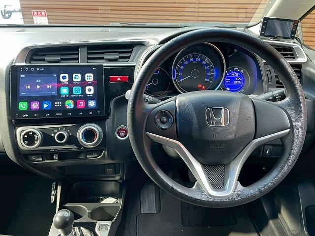 フィット 13G Fパッケージ 社外ナビ スマートキー プッシュスタート アイドリングストップ 横滑り防止装置 オートライト エアコン(67枚目)