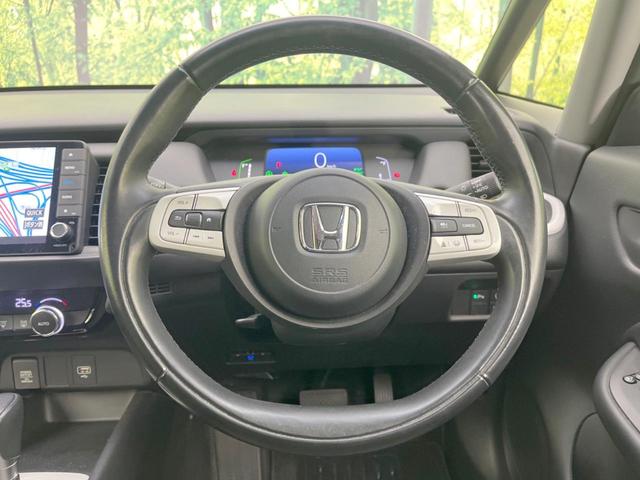 フィット ｅ：ＨＥＶホーム　純正ＳＤナビ　バックカメラ　ホンダセンシング　レーダークルーズ　禁煙車　ドラレコ　コーナーセンサー　スマートキー　ＬＥＤヘッド　ビルトインＥＴＣ　オートハイビーム　車線逸脱警報　オートライト（11枚目）