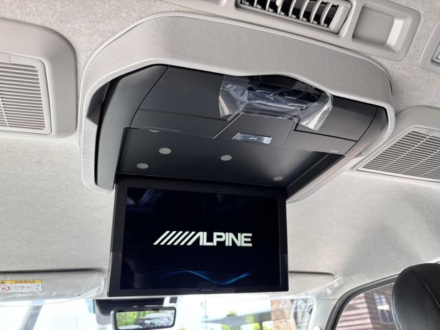 ハイエースワゴン GL 未登録新車/4WD/4列10人乗り/フリップダウンモニター/パワースライドドア/ベッド/シートカバー/床張り/ユーロボンネット/フロントリップ/ファブレス16インチアルミホイール/マッドフラップ(3枚目)