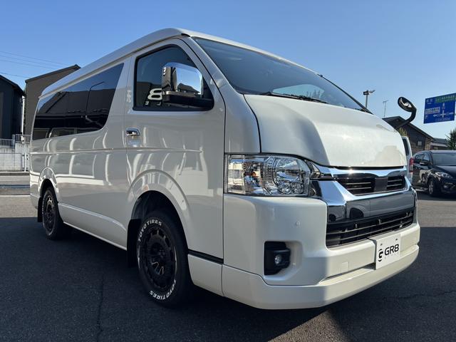 ハイエースワゴン GL 未登録新車/4WD/4列10人乗り/フリップダウンモニター/パワースライドドア/ベッド/シートカバー/床張り/ユーロボンネット/フロントリップ/ファブレス16インチアルミホイール/マッドフラップ(9枚目)