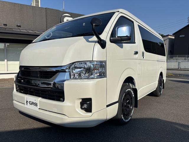 ハイエースワゴン GL 未登録新車/4WD/4列10人乗り/フリップダウンモニター/パワースライドドア/ベッド/シートカバー/床張り/ユーロボンネット/フロントリップ/ファブレス16インチアルミホイール/マッドフラップ(10枚目)