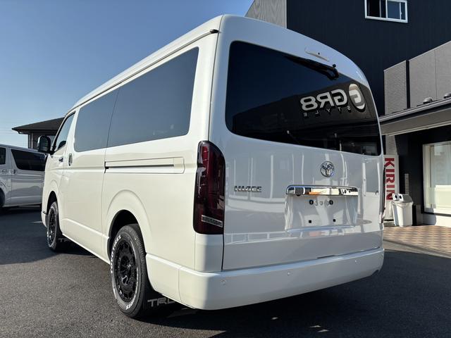 ハイエースワゴン GL 未登録新車/4WD/4列10人乗り/フリップダウンモニター/パワースライドドア/ベッド/シートカバー/床張り/ユーロボンネット/フロントリップ/ファブレス16インチアルミホイール/マッドフラップ(12枚目)