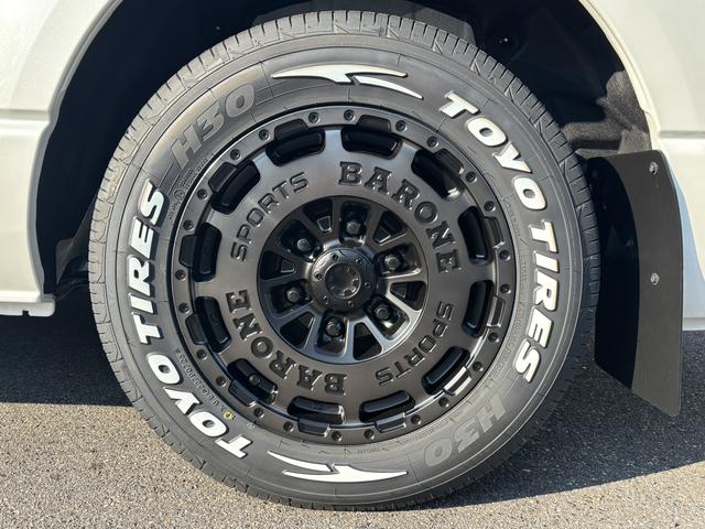 ハイエースワゴン GL 未登録新車/4WD/4列10人乗り/フリップダウンモニター/パワースライドドア/ベッド/シートカバー/床張り/ユーロボンネット/フロントリップ/ファブレス16インチアルミホイール/マッドフラップ(25枚目)