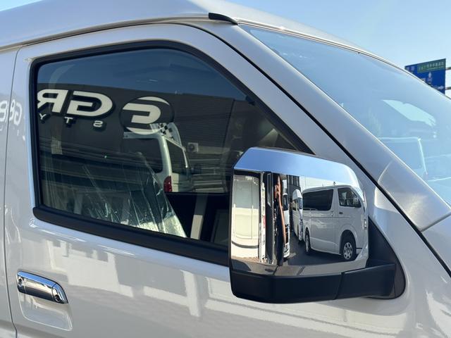 ハイエースワゴン GL 未登録新車/4WD/4列10人乗り/フリップダウンモニター/パワースライドドア/ベッド/シートカバー/床張り/ユーロボンネット/フロントリップ/ファブレス16インチアルミホイール/マッドフラップ(32枚目)
