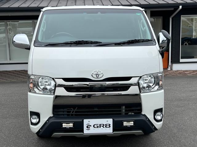 ハイエースバン スーパーGL ダークプライム TRDフロントスポイラー/TRDマッドフラップ/XTREME-J16インチアルミホイール/純正地デジナビ/レザー調シートカバー/ドアポケットアームレスト/助手席エアバッグ/LEDヘッドライト(21枚目)
