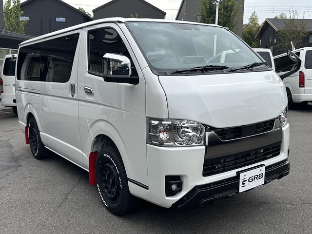 ハイエースバン ロングスーパーＧＬ　ダークプライムＳ　登録済未使用車／４ＷＤ／２０周年記念車／バッドフェイス／フロントスポイラー／アルパインＢＩＧＸナビ／ベッド（9枚目）