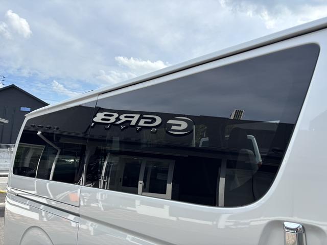 ハイエースバン スーパーＧＬ　ダークプライムＩＩ　未登録新車／ＧＲ８エアロ／レイズ１６インチアルミ／ＢＩＧ－Ｘ／フリップダウンモニター／ベッド／パワスラ／デジミラ（34枚目）