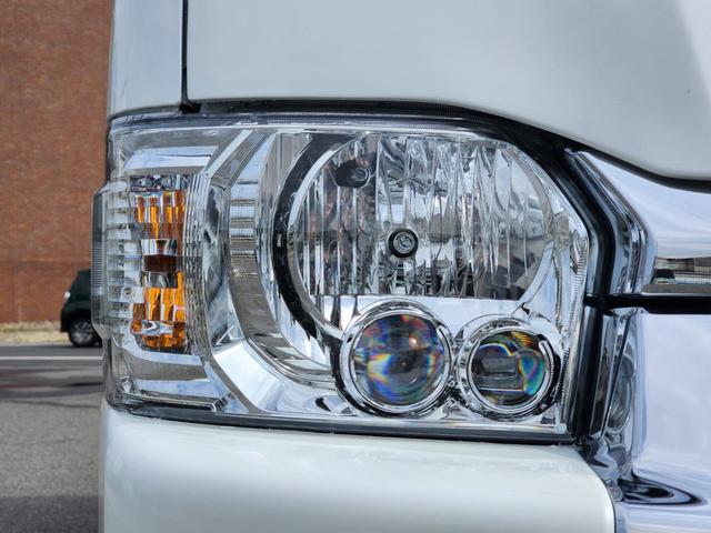 ハイエースワゴン GL 登録済未使用車/メモリーナビTV/HDMIポート/フリップダウンモニター/デジタルインナーM/パノラミックビューM/パワスラ/GR8フルエアロ/17inアルミ/ラプター塗装オーバーフェンダー/ベッド(27枚目)