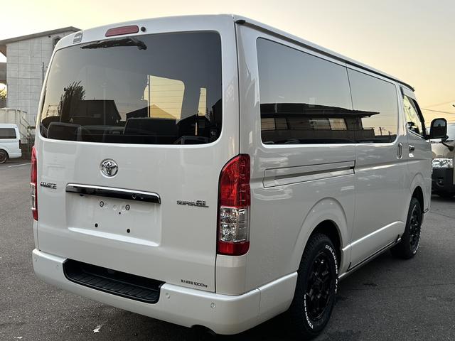 ハイエースバン スーパーＧＬ　リラクベース　タイプＩＩ　４ＷＤ／寒冷地仕様／バッドフェイス／デイライト付フロントスポイラー／１６インチアルミホイール／ＡＴタイヤ（11枚目）