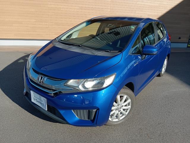 フィットハイブリッド Ｆパッケージ　社外ナビ／スタッドレスタイヤ付／ワンセグＴＶ／ＥＴＣ／スマートキー／プッシュスタート／アイドリングストップ／スペアキー／横滑り防止システム／イモビライザー／ハロゲンライト／パワステ（20枚目）