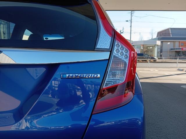 フィットハイブリッド Ｆパッケージ　社外ナビ／スタッドレスタイヤ付／ワンセグＴＶ／ＥＴＣ／スマートキー／プッシュスタート／アイドリングストップ／スペアキー／横滑り防止システム／イモビライザー／ハロゲンライト／パワステ（31枚目）