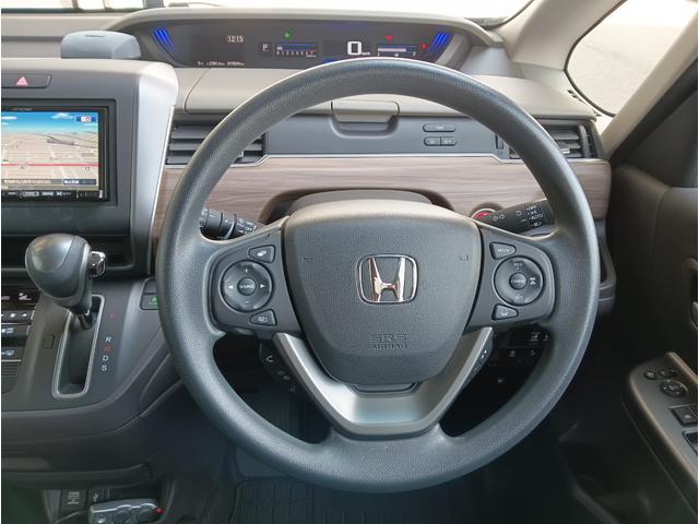 フリード Ｇ・ホンダセンシング　社外ナビ／ＣＤ／ＤＶＤ／後席ヘッドレストツインモニター／両側電動スライドドア／アイドリングストップ／社外ウーファー／ＥＴＣ／ドラレコ（フロントのみ）／Ｂｌｕｅｔｏｏｔｈ／ＬＥＤヘッド／スマートキー（11枚目）