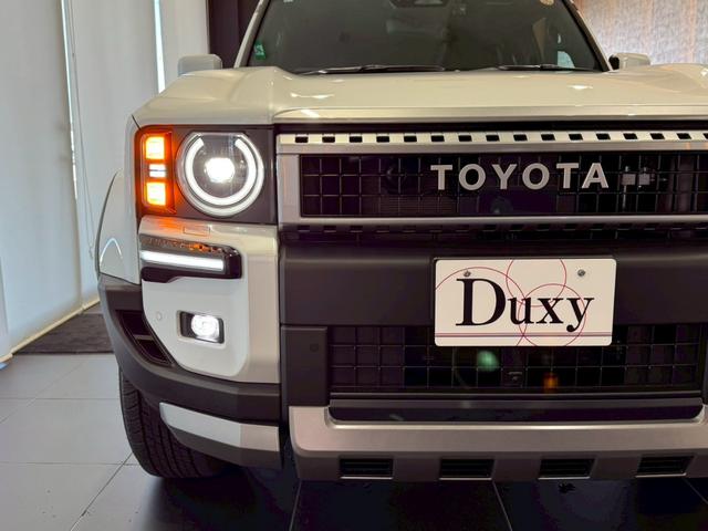 ランドクルーザー２５０ ＶＸ　丸目ヘッドライト　モデリスタパッケージ　モデリスタシグネチャーイルミブレードモデリスタリヤスポイラー　モデリスタオーバーフェンダー　ルーフレール　サンルーフ　ビルトインＥＴＣ　トヨタチームメイト（21枚目）