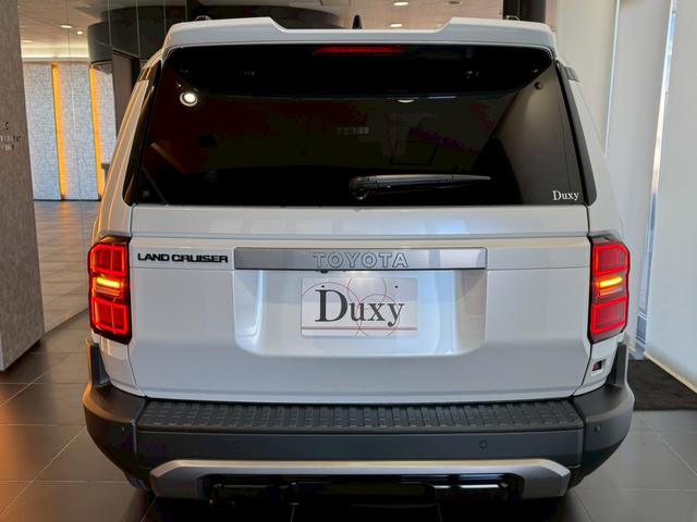 ランドクルーザー２５０ ＶＸ　丸目ヘッドライト　モデリスタパッケージ　モデリスタシグネチャーイルミブレードモデリスタリヤスポイラー　モデリスタオーバーフェンダー　ルーフレール　サンルーフ　ビルトインＥＴＣ　トヨタチームメイト（27枚目）