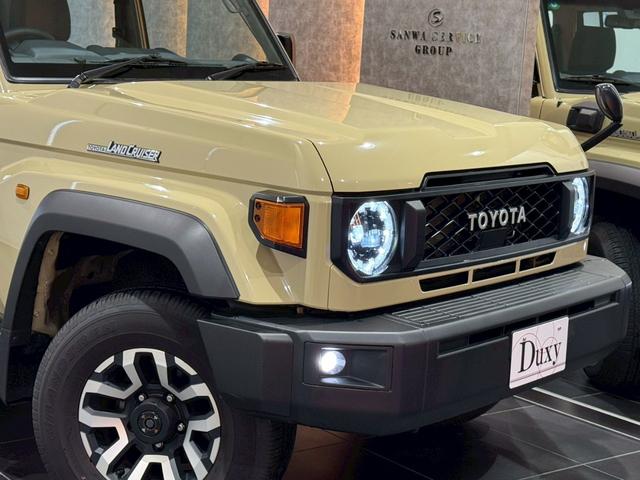 ランドクルーザー７０ ＡＸ　アルパインディスプレイオーディオ　ＨＤＭＩ端子　純正ＥＴＣ　純正バイザー　ＬＥＤヘッドライト　ウッドコンビステアリング　クルーズコントロール　バックカメラ　ヘッドライトレベライザー　アルミホイール（5枚目）