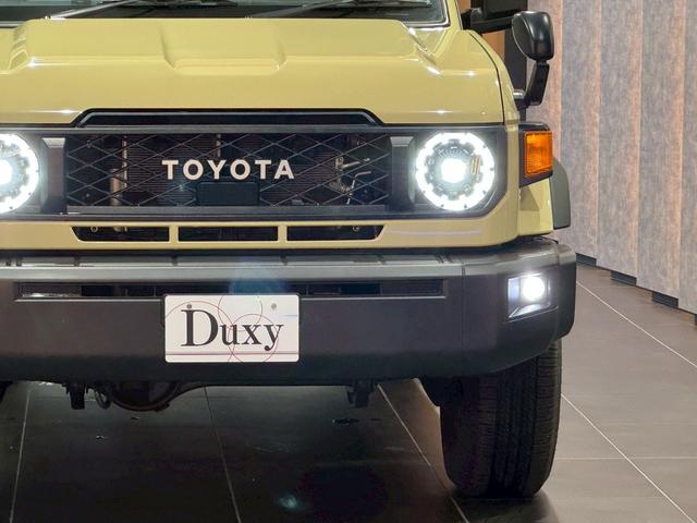 ランドクルーザー７０ ＡＸ　アルパインディスプレイオーディオ　ＨＤＭＩ端子　純正ＥＴＣ　純正バイザー　ＬＥＤヘッドライト　ウッドコンビステアリング　クルーズコントロール　バックカメラ　ヘッドライトレベライザー　アルミホイール（22枚目）