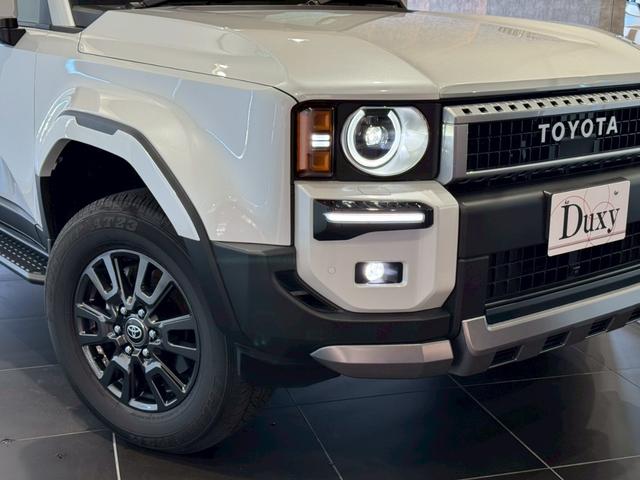 ランドクルーザー２５０ ＶＸ　丸目ヘッドライト　モデリスタパッケージ　モデリスタシグネチャーイルミブレードモデリスタリヤスポイラー　モデリスタオーバーフェンダー　ルーフレール　サンルーフ　ビルトインＥＴＣ　トヨタチームメイト（5枚目）