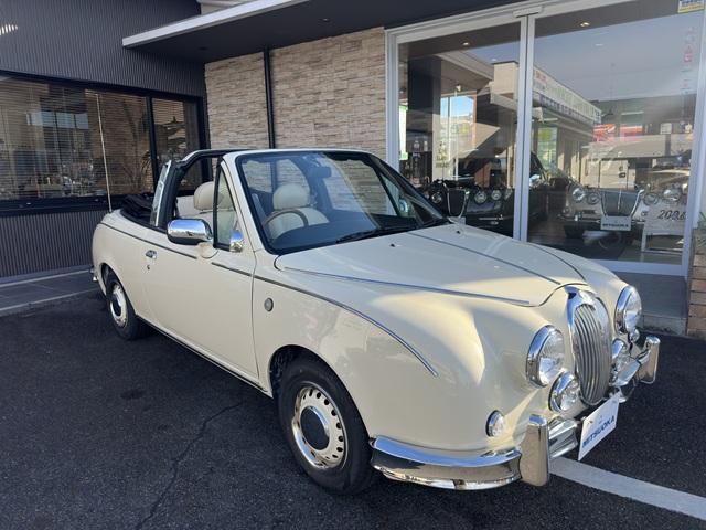 ビュート コンバーチブル　クーペコンバーチブル　電動Ｏ・Ｐ　社外新品幌　黒内装　木目調インパネ　社外新品ウッドステアリング　レザー調Ｓ　社外新品ＳＤナビ＋フルセグＴＶ　バックカメラ　ＥＴＣ　社外新品キーレス　取説　保証書（3枚目）