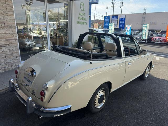 ビュート コンバーチブル　クーペコンバーチブル　電動Ｏ・Ｐ　社外新品幌　黒内装　木目調インパネ　社外新品ウッドステアリング　レザー調Ｓ　社外新品ＳＤナビ＋フルセグＴＶ　バックカメラ　ＥＴＣ　社外新品キーレス　取説　保証書（5枚目）