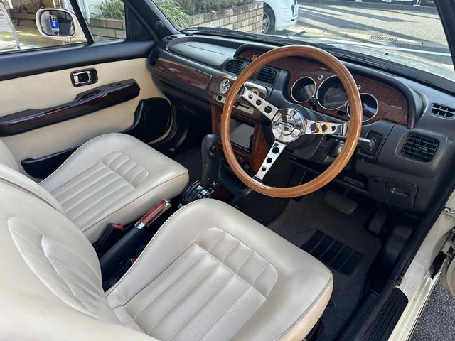 ビュート コンバーチブル　クーペコンバーチブル　電動Ｏ・Ｐ　社外新品幌　黒内装　木目調インパネ　社外新品ウッドステアリング　レザー調Ｓ　社外新品ＳＤナビ＋フルセグＴＶ　バックカメラ　ＥＴＣ　社外新品キーレス　取説　保証書（32枚目）