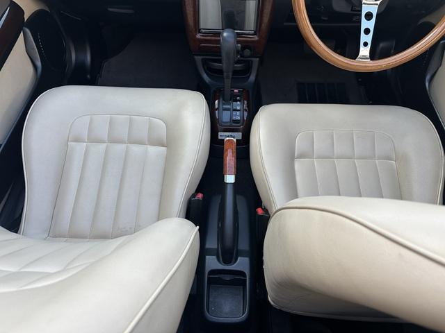 ビュート コンバーチブル　クーペコンバーチブル　電動Ｏ・Ｐ　社外新品幌　黒内装　木目調インパネ　社外新品ウッドステアリング　レザー調Ｓ　社外新品ＳＤナビ＋フルセグＴＶ　バックカメラ　ＥＴＣ　社外新品キーレス　取説　保証書（41枚目）