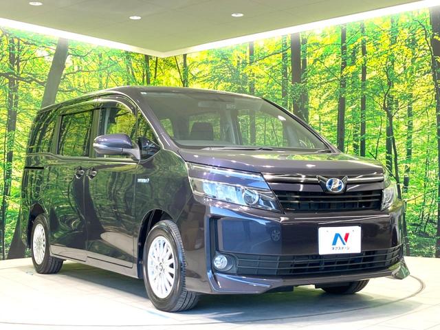 ヴォクシー ハイブリッドV 禁煙車 フリップダウンモニター 純正SDナビ 前席シートヒーター 置くだけ充電 電動スライドドア バックカメラ ドラレコ LEDヘッドライト ETC クルコン オートライト 純正15インチAW(19枚目)