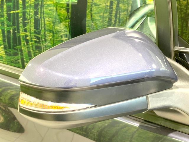 ヴォクシー ハイブリッドV 禁煙車 フリップダウンモニター 純正SDナビ 前席シートヒーター 置くだけ充電 電動スライドドア バックカメラ ドラレコ LEDヘッドライト ETC クルコン オートライト 純正15インチAW(63枚目)