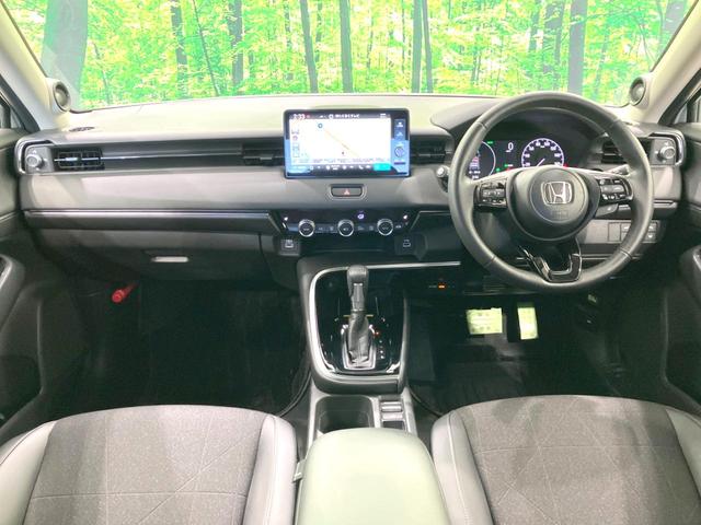 ヴェゼル e:HEV Z 禁煙車 純正9型ナビ 全周囲カメラ 衝突被害軽減システム レーダークルーズ BSM 電動リアゲート ハーフレザー ドラレコ ステアリングヒーター ETC2.0 オートライト デュアルエアコン(2枚目)