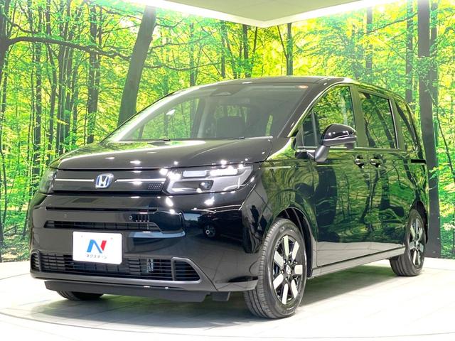 フリード e:HEVエアー EX 登録済未使用車 両側電動ドア 衝突被害軽減システム レーダークルーズ ハーフレザーシート コーナーセンサー スマートキー LEDヘッド 車線逸脱警報 オートライト オートエアコン(25枚目)