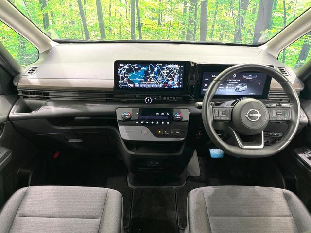 セレナ ハイウェイスターV 禁煙車 現行 メーカー純正12型ナビ 全周囲カメラ 後席モニター プロパイロット 前席シートヒーター 衝突被害軽減ブレーキ 両側パワースライドドア オートエアコン LEDヘッドライト ETC(2枚目)