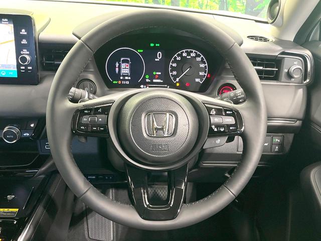 ヴェゼル ｅ：ＨＥＶ　Ｚ　登録済未使用車　純正８型ナビ　全周囲カメラ　衝突被害軽減システム　レーダークルーズ　ＢＳＭ　電動リアゲート　ハーフレザー　前席シートヒーター　ＬＥＤヘッド　ビルトインＥＴＣ　純正１８インチＡＷ（11枚目）