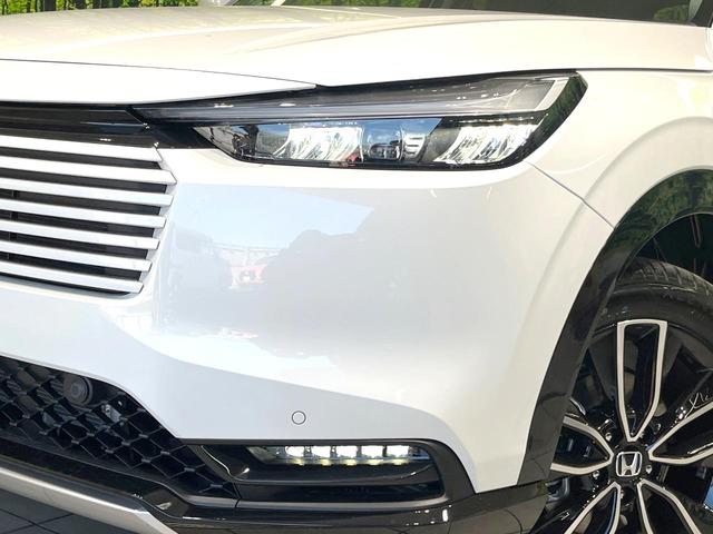 ヴェゼル ｅ：ＨＥＶ　Ｚ　登録済未使用車　純正８型ナビ　全周囲カメラ　衝突被害軽減システム　レーダークルーズ　ＢＳＭ　電動リアゲート　ハーフレザー　前席シートヒーター　ＬＥＤヘッド　ビルトインＥＴＣ　純正１８インチＡＷ（12枚目）