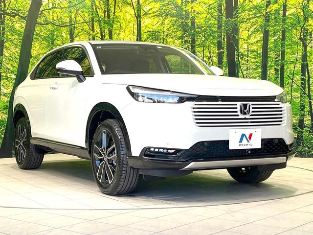 ヴェゼル ｅ：ＨＥＶ　Ｚ　登録済未使用車　純正８型ナビ　全周囲カメラ　衝突被害軽減システム　レーダークルーズ　ＢＳＭ　電動リアゲート　ハーフレザー　前席シートヒーター　ＬＥＤヘッド　ビルトインＥＴＣ　純正１８インチＡＷ（16枚目）