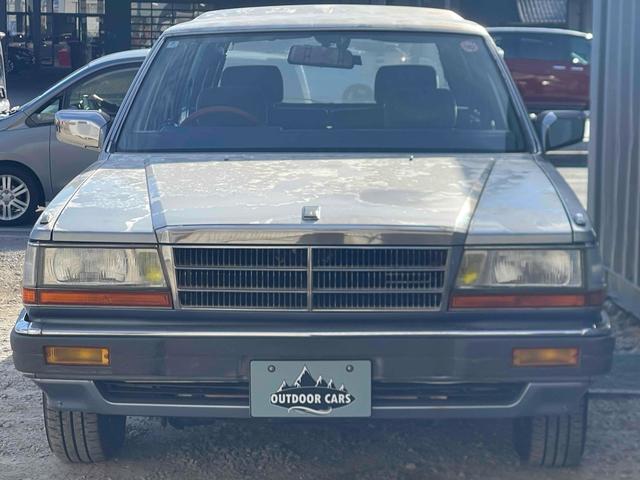 グロリアワゴン ＧＬ　５ＭＴ　ナルディウッドステアリング　買取車両　デジタルインナーミラー　木目調サイドデカール　純正ホイール　ユピテルセキュリティ　レザー調革張り　３列７人乗り　ＥＴＣ　電動格納ミラー　エアコン（12枚目）