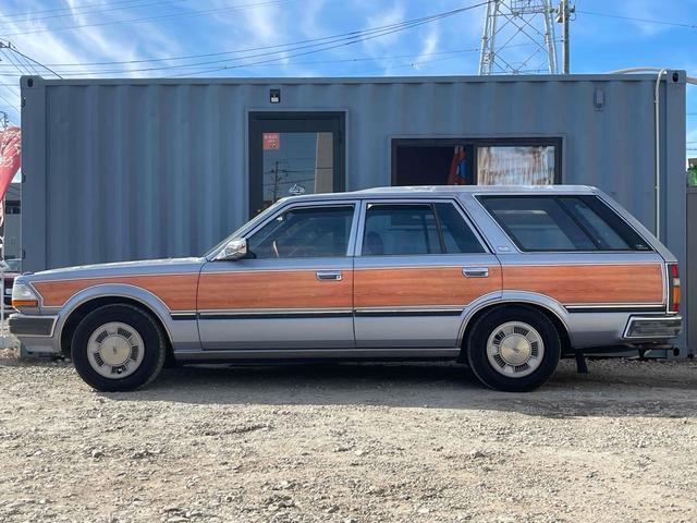 グロリアワゴン ＧＬ　５ＭＴ　ナルディウッドステアリング　買取車両　デジタルインナーミラー　木目調サイドデカール　純正ホイール　ユピテルセキュリティ　レザー調革張り　３列７人乗り　ＥＴＣ　電動格納ミラー　エアコン（17枚目）