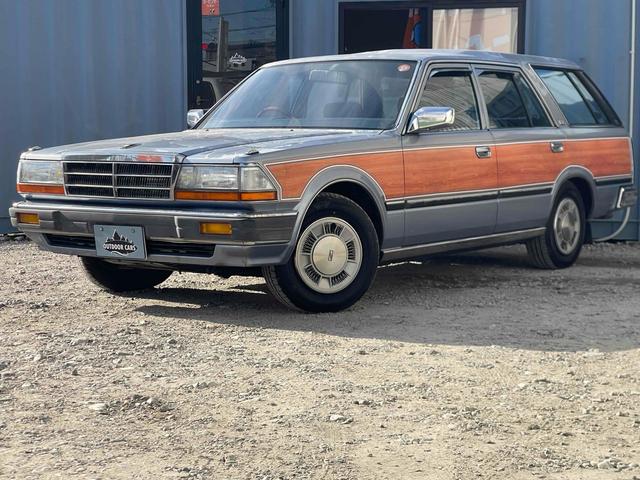 グロリアワゴン ＧＬ　５ＭＴ　ナルディウッドステアリング　買取車両　デジタルインナーミラー　木目調サイドデカール　純正ホイール　ユピテルセキュリティ　レザー調革張り　３列７人乗り　ＥＴＣ　電動格納ミラー　エアコン（22枚目）