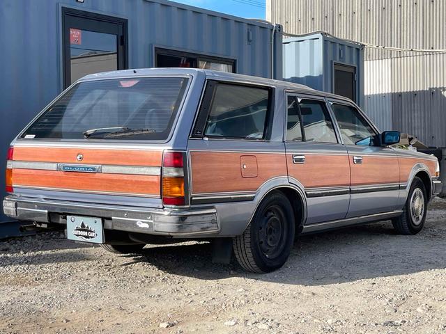 グロリアワゴン ＧＬ　５ＭＴ　ナルディウッドステアリング　買取車両　デジタルインナーミラー　木目調サイドデカール　純正ホイール　ユピテルセキュリティ　レザー調革張り　３列７人乗り　ＥＴＣ　電動格納ミラー　エアコン（64枚目）