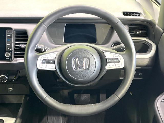 フィット ｅ：ＨＥＶホーム　後期　禁煙車　純正９型ナビ　ホンダセンシング　バックカメラ　ＥＴＣ　アダプティブクルコン　ハーフレザーシート　コーナーセンサー　ＬＥＤヘッド　オートライト　オートエアコン　スマートキー（11枚目）