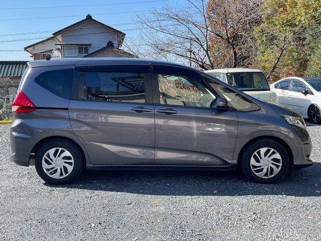 フリード G・ホンダセンシング 両側電動スライドドア・純正ナビ・Bluetoothオーディオ・バックカメラ・ETC・アダプティブクルーズコントロール・LEDヘッドライト・Cパッケージ・コンフォートビューパッケージ・軽減ブレーキ・禁煙(14枚目)