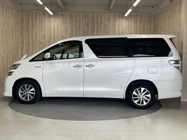 ヴェルファイアハイブリッド V 6ヶ月走行無制限保証付き Wサンルーフ 純正8型ナビ 両側パワースライドドア 電動リアゲート 寒冷地仕様 禁煙車 バックカメラ オットマン Wエアコン ETC 純正16インチアルミホイール クルコン(21枚目)