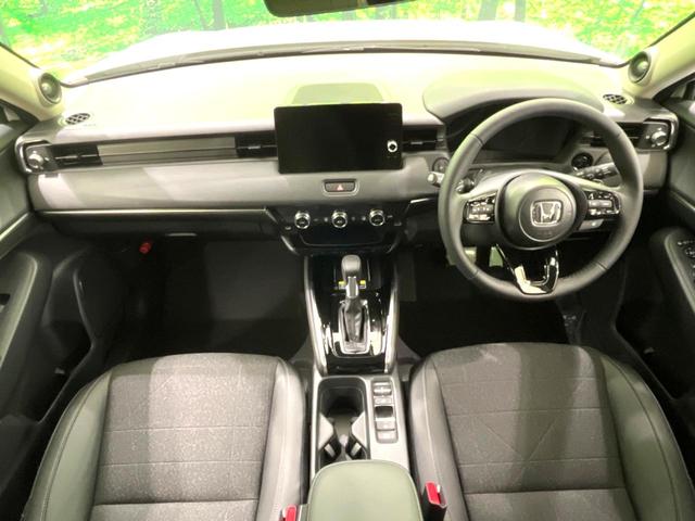 ヴェゼル ｅ：ＨＥＶ　Ｚ　登録済未使用車　純正９インチナビ　全周囲カメラ　衝突軽減　レーダークルーズ　ＥＴＣ　ＬＥＤヘッド　オートライト　オートエアコン　電動リアゲート　前席シートヒーター　コーナーセンサー　電動パーキング（2枚目）