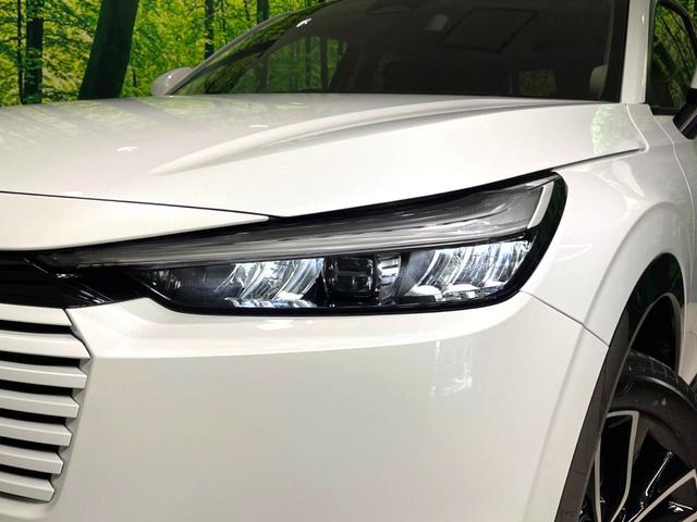 ヴェゼル ｅ：ＨＥＶ　Ｚ　登録済未使用車　純正９インチナビ　全周囲カメラ　衝突軽減　レーダークルーズ　ＥＴＣ　ＬＥＤヘッド　オートライト　オートエアコン　電動リアゲート　前席シートヒーター　コーナーセンサー　電動パーキング（62枚目）