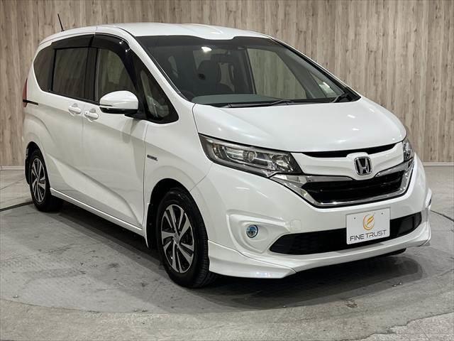 フリードハイブリッド ハイブリッド・ＥＸ　純正ＳＤナビ　純正フリップダウンモニター　ホンダセンシング　ハーフレザーシート　両側パワースライドドア　シートヒーター　レーダークルーズコントロール　衝突軽減ブレーキ　ＬＥＤヘッドライト　禁煙車（16枚目）