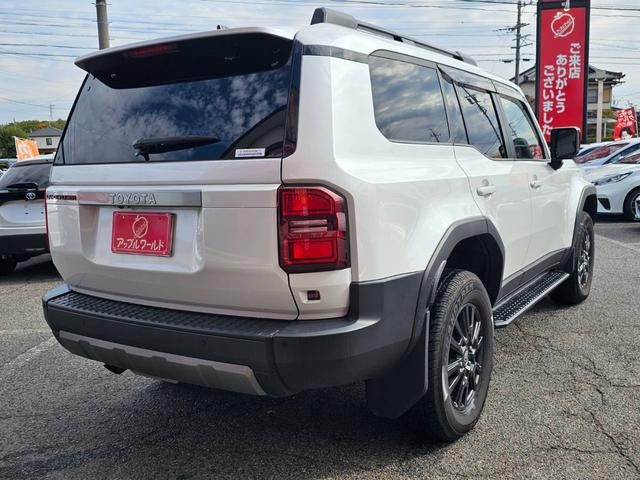 ランドクルーザー２５０ ＶＸ　ワンオーナー　禁煙車　トヨタチームメイト　丸目ヘッドライト　純正ナビ　全方位カメラ　デジタルインナーミラー　ムーンルーフ　ルーフレール　スペアタイヤ　黒革シート　スペアタイヤ　ビルトインＥＴＣ２．０（12枚目）