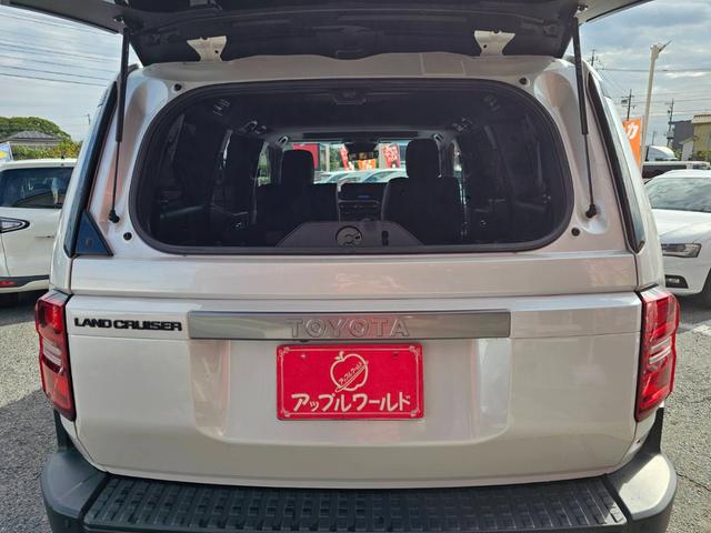 ランドクルーザー２５０ ＶＸ　ワンオーナー　禁煙車　トヨタチームメイト　丸目ヘッドライト　純正ナビ　全方位カメラ　デジタルインナーミラー　ムーンルーフ　ルーフレール　スペアタイヤ　黒革シート　スペアタイヤ　ビルトインＥＴＣ２．０（42枚目）