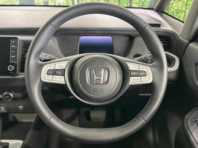 フィット e:HEVホーム 純正9インチナビ バックカメラ 衝突被害軽減システム レーダークルーズ 禁煙車 コーナーセンサー スマートキー LEDヘッド ETC オートハイビーム 車線逸脱警報 オートライト オートエアコン(11枚目)