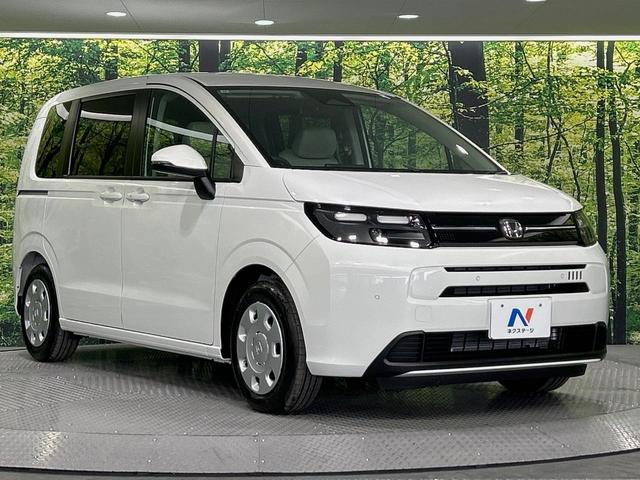 フリード エアー 登録済未使用車 純正ディスプレイオーディオ 両側電動ドア バックカメラ 衝突軽減 レーダークルーズ コーナーセンサー スマートキー LEDヘッド オートハイビーム 車線逸脱警報 オートエアコン(16枚目)