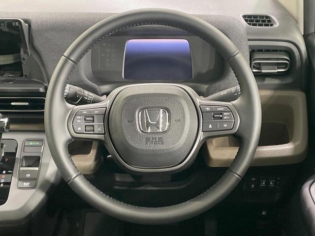 フリード エアー　ＥＸ　登録済未使用車　４ＷＤ　両側電動ドア　衝突被害軽減システム　レーダークルーズ　禁煙車　コーナーセンサー　スマートキー　ＬＥＤヘッド　オートハイビーム　車線逸脱警報　オートライト　オートエアコン（12枚目）